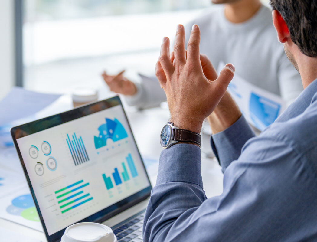 Man looking at dashboard on laptop